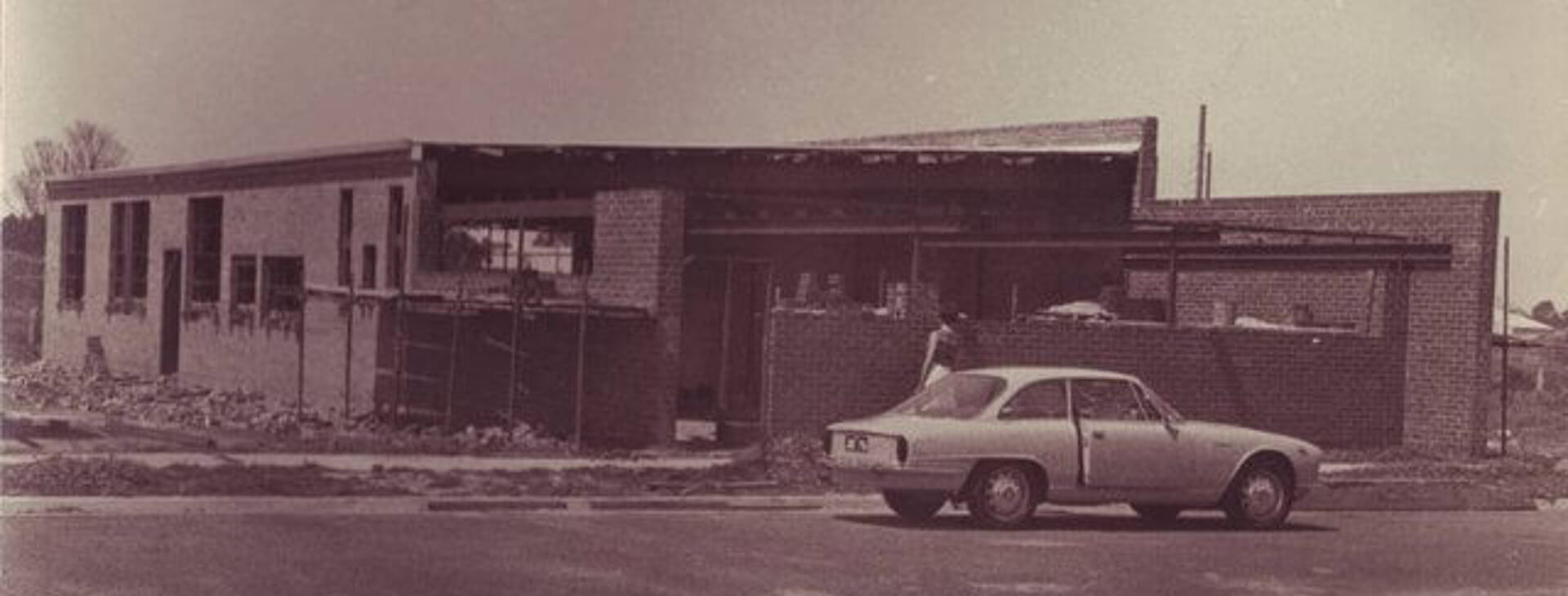 Congratulations PEMARA – 50 years in print and still going strong car in front of small factory