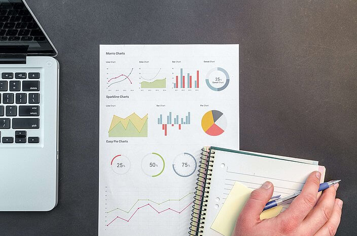 hand laptop paper graphs
