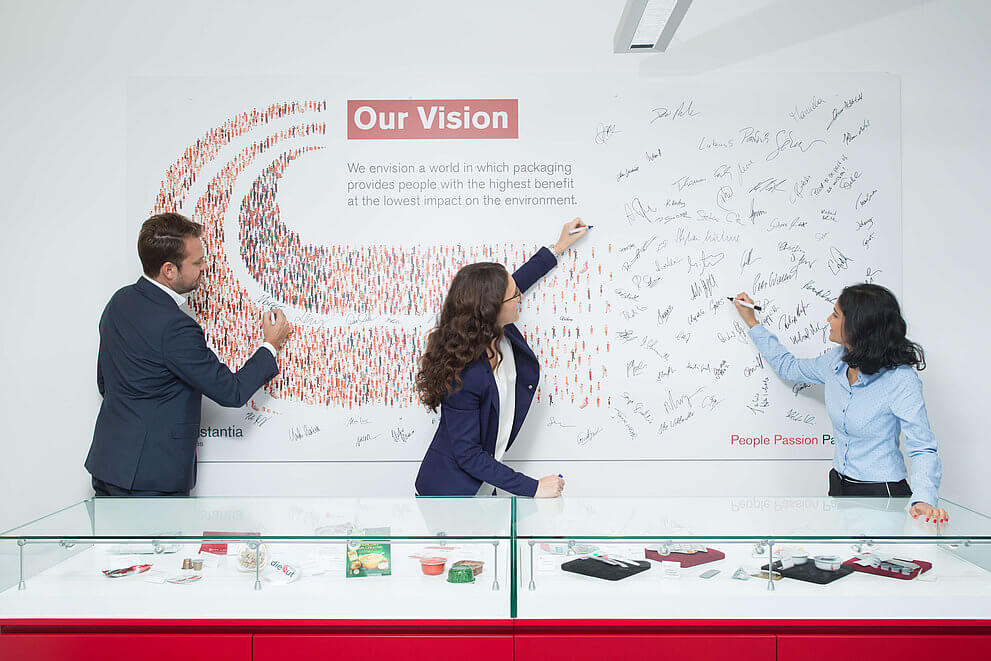 Cflex employees singing the Our Vision poster